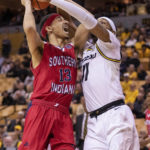 
              Southern Indiana's Jeremiah Hernandez, left, is fouled by Missouri's Isiaih Mosley, right, during the first half of an NCAA college basketball game Saturday, Nov. 7, 2022, in Columbia, Mo. Missouri won 97-91. (AP Photo/L.G. Patterson)
            