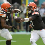
              Cleveland Browns quarterback Jacoby Brissett (7) hands the back to running back Nick Chubb (24) during the first half of an NFL football game against the Miami Dolphins, Sunday, Nov. 13, 2022, in Miami Gardens, Fla. (AP Photo/Lynne Sladky)
            