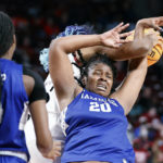 
              Hampton forward Nylah Young (20) battles South Carolina forward Aliyah Boston for a rebound during the first quarter of an NCAA college basketball game in Columbia, S.C., Sunday, Nov. 27, 2022. (AP Photo/Nell Redmond)
            