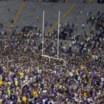Fans gather on the field after an NCAA college football game between LSU and Alabama in Baton Rouge, La., Saturday, Nov. 5, 2022. LSU won 32-31 in overtime. (AP Photo/Tyler Kaufman)
