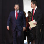 New Nebraska NCAA college football coach Matt Rhule, left, arrives with athletic director Trev Alberts for an introductory press conference, Monday, Nov. 28, 2022, in Lincoln, Neb. (AP Photo/Rebecca S. Gratz)