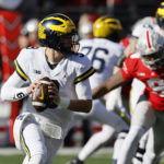 
              Michigan quarterback J.J. McCarthy drops back to pass against Ohio State during the first half of an NCAA college football game on Saturday, Nov. 26, 2022, in Columbus, Ohio. (AP Photo/Jay LaPrete)
            