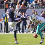 
              Miami Dolphins linebacker Jaelan Phillips, right, blocks a kick by Chicago Bears punter Trenton Gill (16) during the first half of an NFL football game, Sunday, Nov. 6, 2022 in Chicago. Linebacker Andrew Van Ginkel picked up the ball for a touch down. (AP Photo/Charles Rex Arbogast)
            