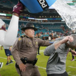 
              Florida State head coach Mike Norvell, right, is dunked with liquid after an NCAA college football game against Miami, Saturday, Nov. 5, 2022, in Miami Gardens, Fla. Florida State won 45-3. (AP Photo/Lynne Sladky)
            