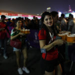 Fans carry their beers at a fan zone ahead of the FIFA World Cup, in Doha, Qatar Saturday, Nov. 19, 2022. (AP Photo/)