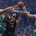 Cleveland Cavaliers center Jarrett Allen (31) competes for a rebound against Boston Celtics center Al Horford (42) and forward Jayson Tatum (0) during the first half of an NBA basketball game, Wednesday, Nov. 2, 2022, in Cleveland. (AP Photo/Ron Schwane)