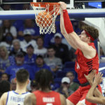 Duquesne's Austin Rotroff (34) dunks during the second half of an NCAA college basketball game against Kentucky in Lexington, Ky., Friday, Nov. 11, 2022. (AP Photo/James Crisp)
