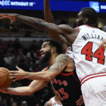 
              Toronto Raptors' Fred VanVleet (23) goes up for a shot as Chicago Bulls' Patrick Williams (44) defends during the first half of an NBA basketball game Monday, Nov. 7, 2022, in Chicago. (AP Photo/Paul Beaty)
            
