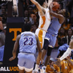 McNeese State guard Trae English (1) is fouled by Tennessee forward Olivier Nkamhoua (13) during the first half of an NCAA college basketball game Wednesday, Nov. 30, 2022, in Knoxville, Tenn. (AP Photo/Wade Payne)