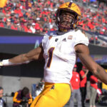 Arizona State running back Xazavian Valladay reacts after scoring atouchdown against Arizona in the first half of an NCAA college football game, Friday, Nov. 25, 2022, in Tucson, Ariz. (AP Photo/Rick Scuteri)
