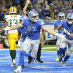 
              Detroit Lions defensive end Aidan Hutchinson (97) reacts after intercepting a pass intended for Green Bay Packers wide receiver Allen Lazard (13) during the first half of an NFL football game, Sunday, Nov. 6, 2022, in Detroit. (AP Photo/Paul Sancya)
            