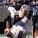 Oregon State running back Damien Martinez celebrates his touchdown against Arizona State with Oregon State tight end Jake Overman during the first half of an NCAA college football game in Tempe, Ariz., Saturday, Nov. 19, 2022. (AP Photo/Ross D. Franklin)