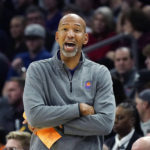 Phoenix Suns coach Monty Williams talks with his players on the court during the first half of the team's NBA basketball game against the Chicago Bulls in Phoenix, Wednesday, Nov. 30, 2022. The Suns won 132-113. (AP Photo/Ross D. Franklin)