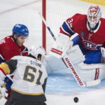
              Montreal Canadiens goaltender Jake Allen watches as Vegas Golden Knights' Mark Stone (61) and Canadiens' Jake Evans vie for the puck during the first period of an NHL hockey game Saturday, Nov. 5, 2022, in Montreal. (Graham Hughes/The Canadian Press via AP)
            