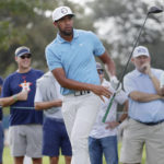 
              CORRECTS TO 12TH HOLE, NOT 11TH HOLE - Tony Finau reacts as he watches his tee shot on the 12th hole during the second round of the Houston Open golf tournament Friday, Nov. 11, 2022, in Houston. (AP Photo/Michael Wyke)
            