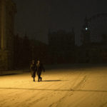 
              People walk in the snow in the city center of Kyiv, Ukraine, late Friday, Nov. 18, 2022. (AP Photo/Andrew Kravchenko)
            