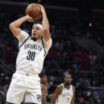Brooklyn Nets guard Seth Curry (30) shoots against the Los Angeles Clippers during the second half of an NBA basketball game Saturday, Nov. 12, 2022, in Los Angeles. (AP Photo/Marcio Jose Sanchez)