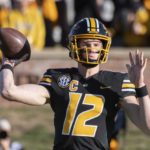 
              Missouri quarterback Brady Cook throws a pass during the first quarter of an NCAA college football game against Arkansas, Friday, Nov. 25, 2022, in Columbia, Mo. (AP Photo/L.G. Patterson)
            