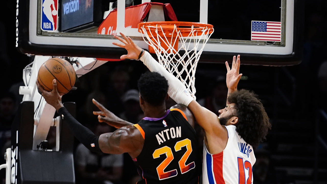 Detroit Pistons' Isaiah Livers (12 ) defends against Phoenix Suns' Deandre Ayton (22) during the fi...