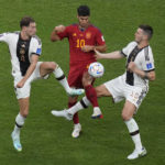 
              Spain's Marcos Asensio, centre, challenges for the ball with Germany's Leon Gorentzka, left, and Germany's Niklas Suele during the World Cup group E soccer match between Spain and Germany, at the Al Bayt Stadium in Al Khor, Qatar, Sunday, Nov. 27, 2022. (AP Photo/Ricardo Mazalan)
            