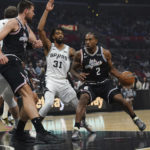 
              Los Angeles Clippers forward Kawhi Leonard (2) drives to the basket during the first half of the team's NBA basketball game against the San Antonio Spurs on Saturday, Nov. 19, 2022, in Los Angeles. (AP Photo/Allison Dinner)
            