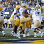 
              UCLA running back Zach Charbonnet (24) scores a touchdown during the second half of the team's NCAA college football game against California in Berkeley, Calif., Friday, Nov. 25, 2022. (AP Photo/Jed Jacobsohn)
            
