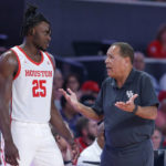 
              Houston head coach Kelvin Sampson, right, talks with forward Jarace Walker (25) during the second half of an NCAA college basketball game against Northern Colorado, Monday, Nov. 7, 2022, in Houston. (AP Photo/Michael Wyke)
            