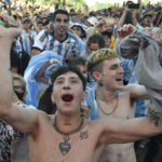 Argentina's soccer fans react at the end of their team's match against Mexico at the World Cup, hosted by Qatar, in Buenos Aires, Argentina, Saturday, Nov. 26, 2022. (AP Photo/Gustavo Garello)