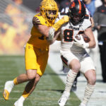 Oregon State tight end Jack Velling (84) gets taken out of bounds by Arizona State linebacker Connor Soelle during the first half of an NCAA college football game in Tempe, Ariz., Saturday, Nov. 19, 2022. (AP Photo/Ross D. Franklin)