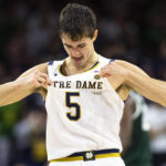 
              Notre Dame's Cormac Ryan celebrates during the first half of the team's NCAA college basketball game against Michigan State on Wednesday, Nov. 30, 2022, in South Bend, Ind. (AP Photo/Michael Caterina)
            