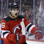 New Jersey Devils center Jack Hughes reacts after scoring a goal against the Washington Capitals during the second period of an NHL hockey game, Saturday, Nov. 26, 2022, in Newark, N.J. (AP Photo/Adam Hunger)
