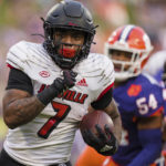 
              Louisville running back Tiyon Evans (7) runs with the ball for a touchdown in the first half of an NCAA college football game against Clemson, Saturday, Nov. 12, 2022, in Clemson, S.C. (AP Photo/Jacob Kupferman)
            
