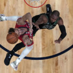 New Orleans Pelicans guard Dyson Daniels, left, battles under the basket with Boston Celtics center Al Horford in the second half of an NBA basketball game in New Orleans, Friday, Nov. 18, 2022. The Pelicans won 117-109. (AP Photo/Gerald Herbert)