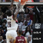 
              Portland Trail Blazers forward Justise Winslow (26) dunks the ball against Miami Heat forward Caleb Martin (16) during the second half of an NBA basketball game, Monday, Nov. 7, 2022, in Miami. (AP Photo/Wilfredo Lee)
            