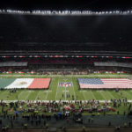Flags for Mexico and the United States are seen on the field before an NFL football game between the Arizona Cardinals and the San Francisco 49ers Monday, Nov. 21, 2022, in Mexico City. (AP Photo/Eduardo Verdugo)
