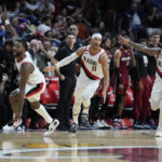 
              Portland Trail Blazers players celebrate after guard Josh Hart (11) made a three-point shot at the buzzer to win an NBA basketball game against the Miami Heat, 110-107, Monday, Nov. 7, 2022, in Miami. (AP Photo/Wilfredo Lee)
            