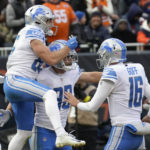 Detroit Lions tight end Brock Wright (89) celebrates his two-yard touchdown reception with quarterback Jared Goff (16) and Tom Kennedy (85) during the first half of an NFL football game against the Chicago Bears in Chicago, Sunday, Nov. 13, 2022. (AP Photo/Charles Rex Arbogast)