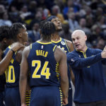 
              Indiana Pacers head coach Rick Carlisle talks with his team during the second quarter of an NBA Basketball game against the New Orleans Pelicans, Monday, Nov. 7, 2022, in Indianapolis, Ind. (AP Photo/Marc Lebryk)
            