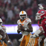 Tennessee quarterback Hendon Hooker (5) looks for an open receiver during the second half of an NCAA college football game against Georgia, Saturday, Nov. 5, 2022 in Athens, Ga. (AP Photo/John Bazemore)