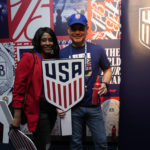 Kanikah Perry-Acosta and Ken Acosta, parents of United States midfielder Kellyn Acosta, pose for a photo during an official U.S. Soccer fan party at the FIFA World Club ahead of a group B soccer match between the United States and Wales, in Doha, Sunday, Nov. 20, 2022. (AP Photo/Ashley Landis)