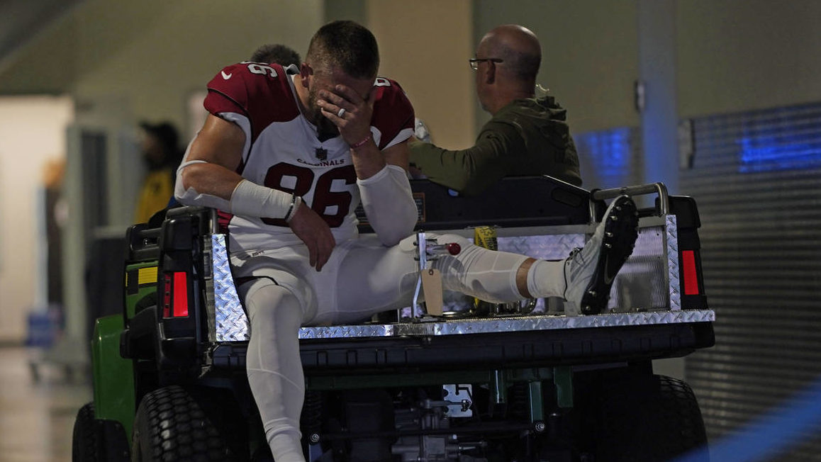 Arizona Cardinals tight end Zach Ertz is carted off the field after an injury during the first half...
