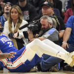 
              Philadelphia 76ers center Joel Embiid reacts to a call during the first half of an NBA basketball game against the Cleveland Cavaliers, Wednesday, Nov. 30, 2022, in Cleveland. (AP Photo/Nick Cammett)
            