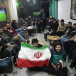 
              Lebanese fans of Iran's team sitting at a coffee shop smoke water pipes, as they watch the World Cup group B soccer match between Iran and the United States, in the Hezbollah stronghold in the southern suburbs of Beirut, Lebanon, Tuesday, Nov. 29, 2022. (AP Photo/Hussein Malla)
            