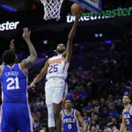 
              Phoenix Suns' Mikal Bridges (25) goes up for a shot against Philadelphia 76ers' Joel Embiid (21) during the second half of an NBA basketball game, Monday, Nov. 7, 2022, in Philadelphia. (AP Photo/Matt Slocum)
            