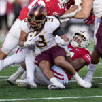 
              Wisconsin linebacker Darryl Peterson (17) tackles Minnesota running back Trey Potts (3) during the first half of an NCAA college football game Saturday, Nov. 26, 2022, in Madison, Wis. (AP Photo/Andy Manis)
            