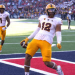 Arizona State tight end Jalin Conyers (12) celebrates after scoring a touchdown against Arizona in the second half during an NCAA college football game, Friday, Nov. 25, 2022, in Tucson, Ariz. (AP Photo/Rick Scuteri)