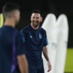 Lionel Messi jokes with teammates during a training of Argentina on the eve of a group C World Cup soccer match against Poland in Doha, Qatar, Tuesday, Nov. 29, 2022. (AP Photo/Jorge Saenz)