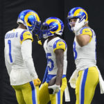 Los Angeles Rams wide receiver Tutu Atwell (15) celebrates with Allen Robinson II (1) after Atwell scored a touchdown against the New Orleans Saints in the first half of an NFL football game in New Orleans, Sunday, Nov. 20, 2022. (AP Photo/Gerald Herbert)
