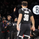 
              The Brooklyn Nets bench reacts to a 3point shot by guard Seth Curry (30) against the Portland Trail Blazers during the first half of an NBA basketball game Sunday, Nov. 27, 2022, in New York. (AP Photo/Jessie Alcheh)
            