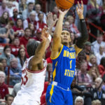 Morehead State guard Tucson Redding (1) takes a shot over the defense of Indiana guard Tamar Bates (53) during the first half of an NCAA college basketball game, Monday, Nov. 7, 2022, in Bloomington, Ind. (AP Photo/Doug McSchooler)